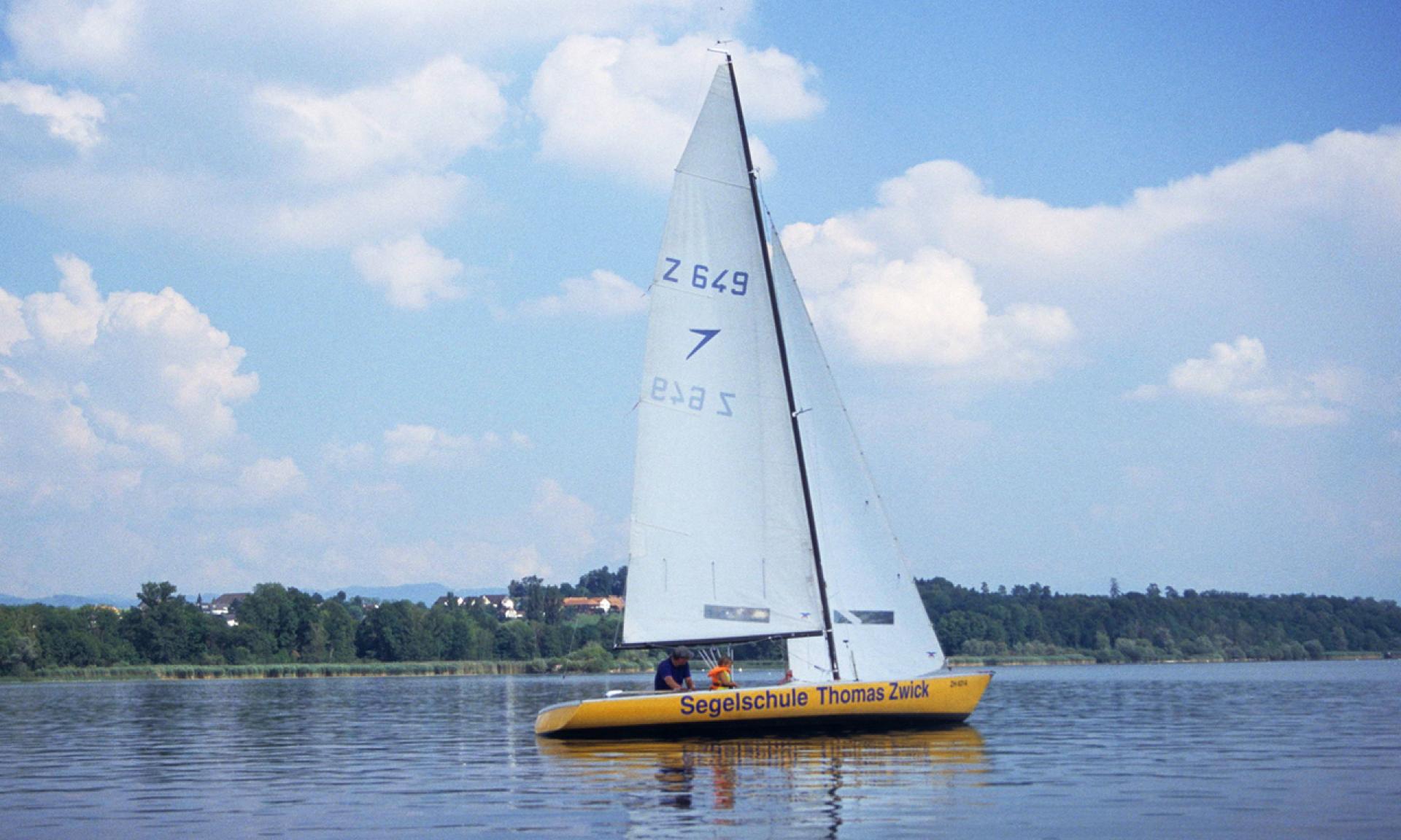 Sail boat of the sailing school Thomas Zwick on the lake